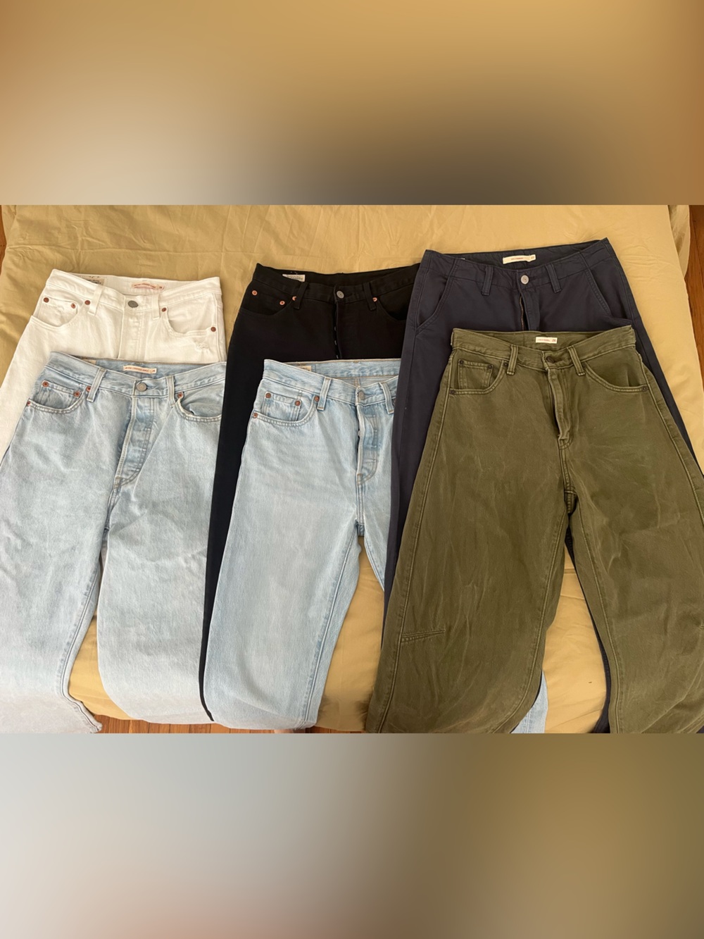 Six Pairs of Jeans in Light Blue, White, Black, Olive, and Navy